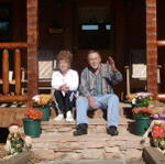 Daddy and Geraldine Sitting On Front Porch