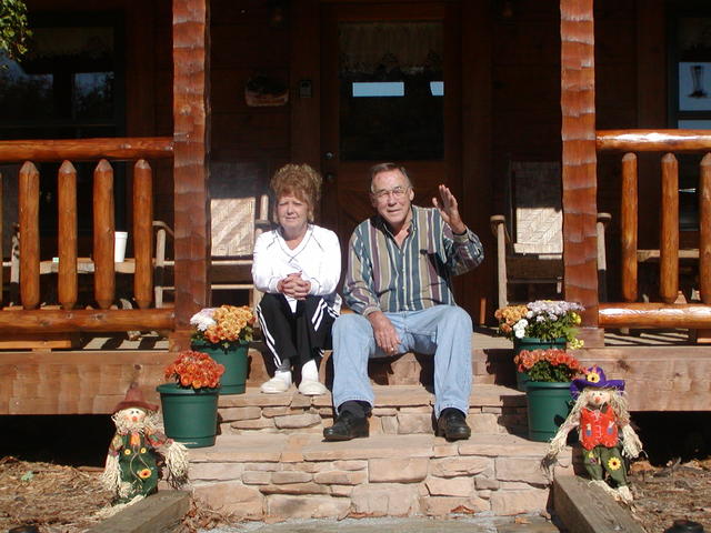 Daddy and Geraldine Sitting On Front Porch