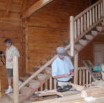 Jack Coming Down The Stairs And Bobby Working On The Railing That Is Coming Down The Stairs.