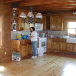 Patty Working In The Kitchen After Sink, Stove And Refrigerator Put In.