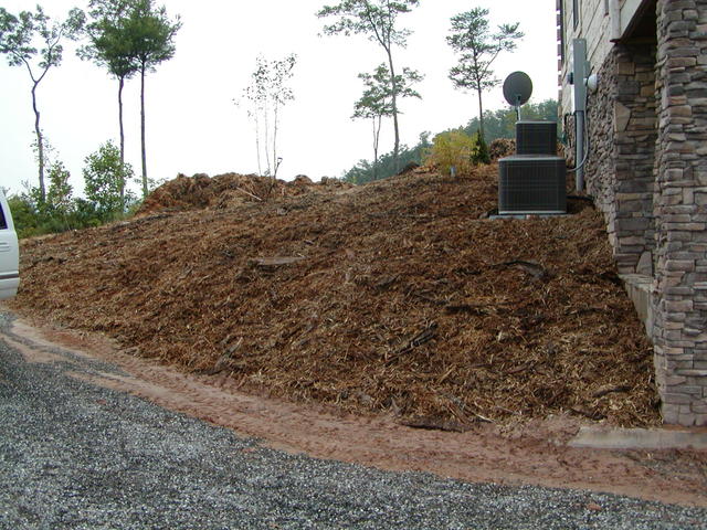 Mulch Was Put Down To Prevent Erosion. We Have Recently Replaced With Retaining Wall And Rock.
