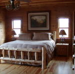 Master Bedroom With Kingsize Log Bed