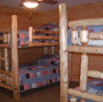 Double log Bunk Beds In Basement Bedroom