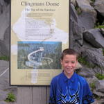 Dustin Standing In Front Of The History Of Clingmans Dome